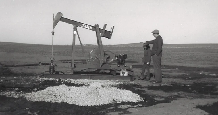 a man standing next to a machine