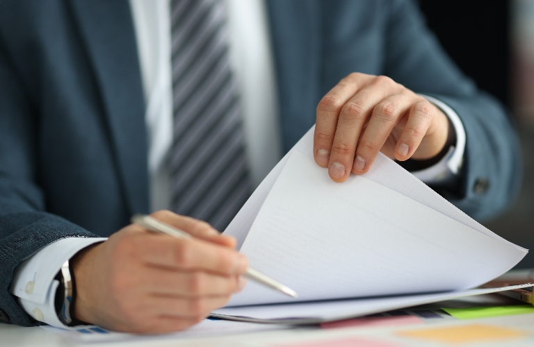 man is reading documents