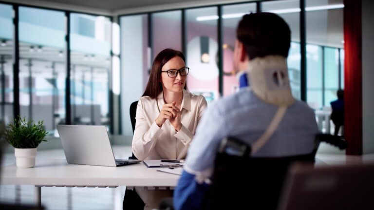 man with serious injuries is consulting with lawyer