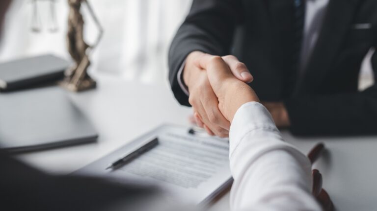 Lawyer shaking hands with a client