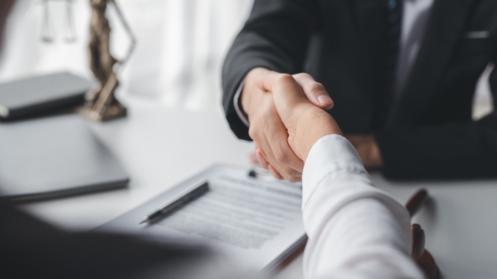 Lawyer shaking hands with a client